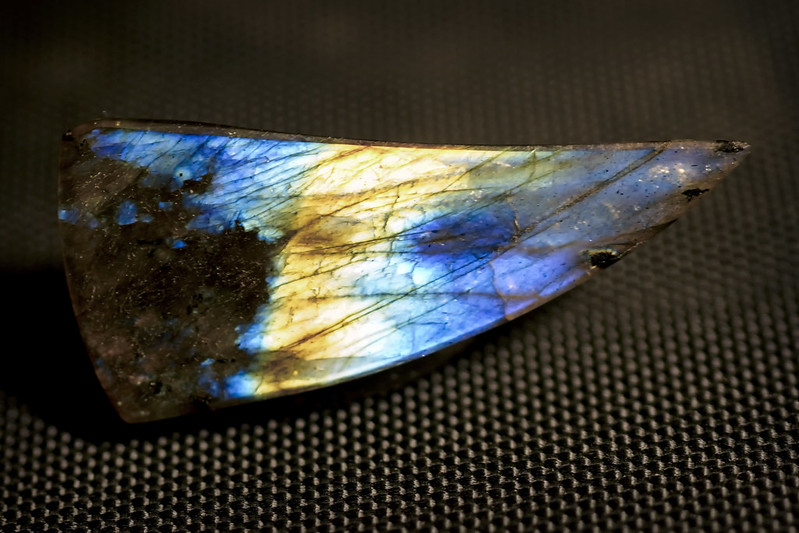 Back side of a Labradorite free-form cabochon gemstone.