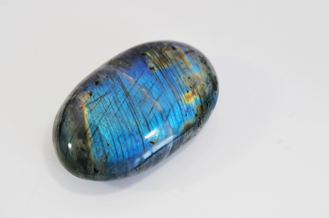 A round stone of labradorite.