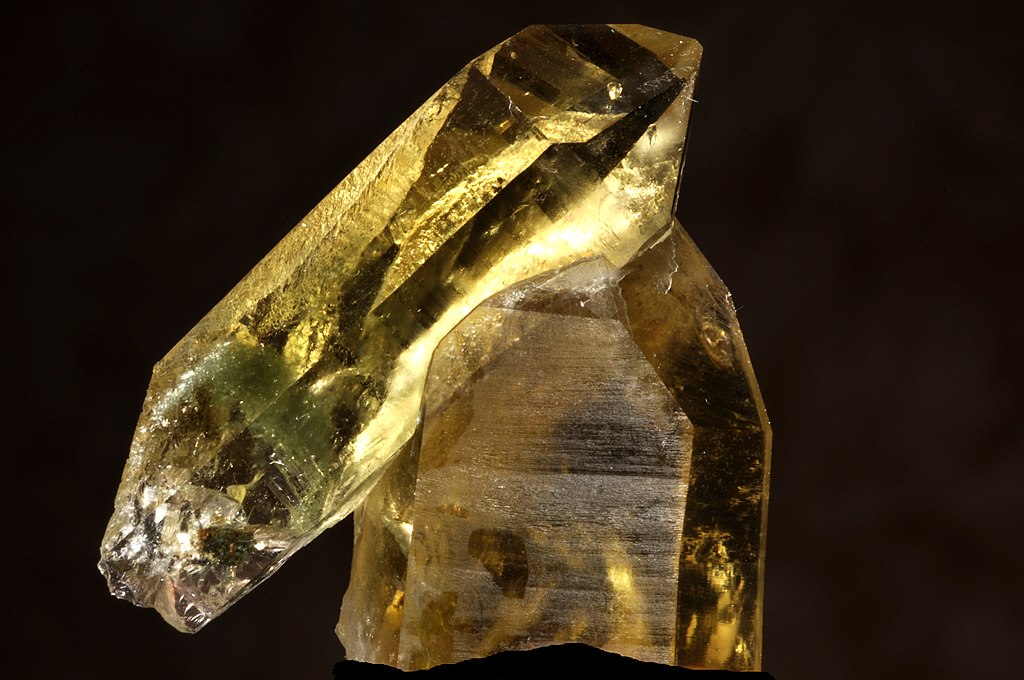 A citrine rock over a black background