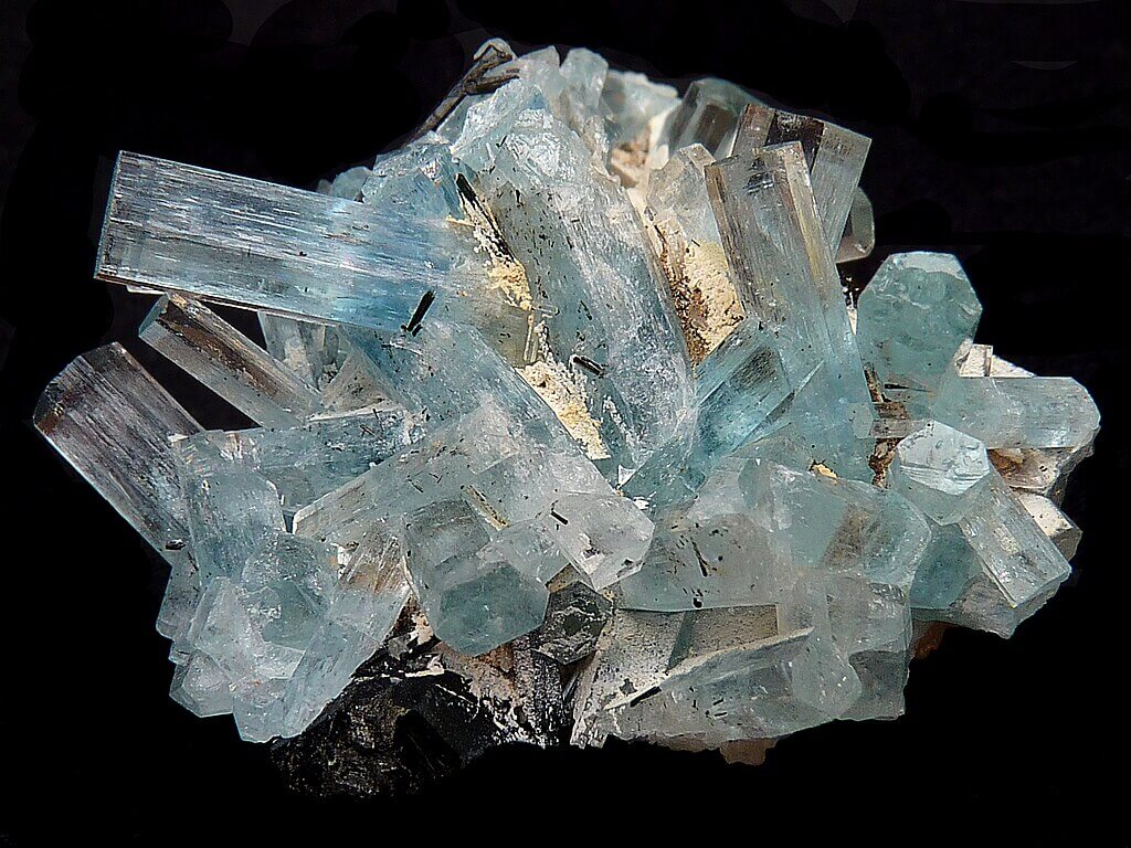 Aquamarine with tourmaline on orthoclase.